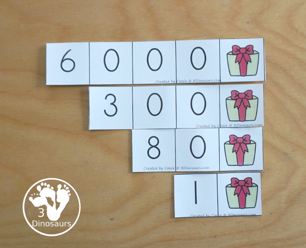 Free Christmas Themed Place Value Arrow Cards - work on building numbers from 0 to 9999 or 9999.99 to 0.99 with these Christmas Themed arrow cards. Plus use task cards to build the numbers. - 3Dinosaurs.com