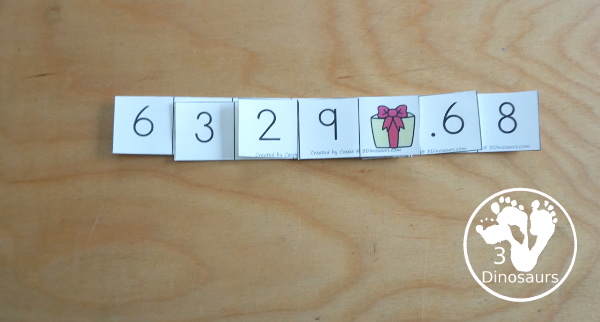 Free Christmas Themed Place Value Arrow Cards - work on building numbers from 0 to 9999 or 9999.99 to 0.99 with these Christmas Themed arrow cards. Plus use task cards to build the numbers. - 3Dinosaurs.com
