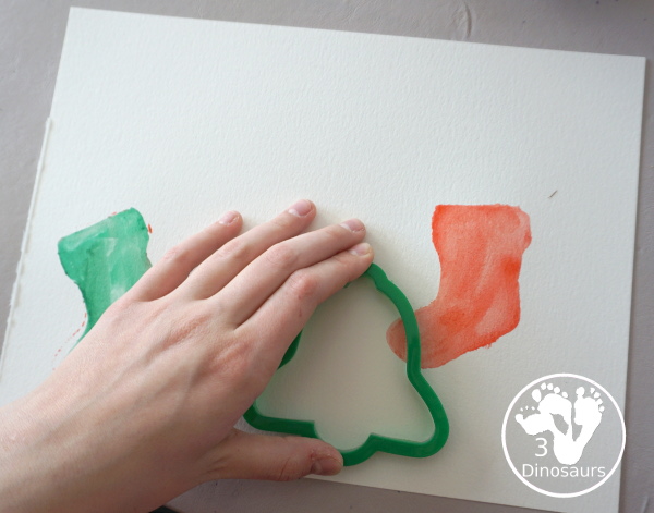 Christmas Watercolor Cookie Cutter Painting - easy Christmas watercolor painting with candy canes, bells, stockings and trees - 3Dinosaurs.com