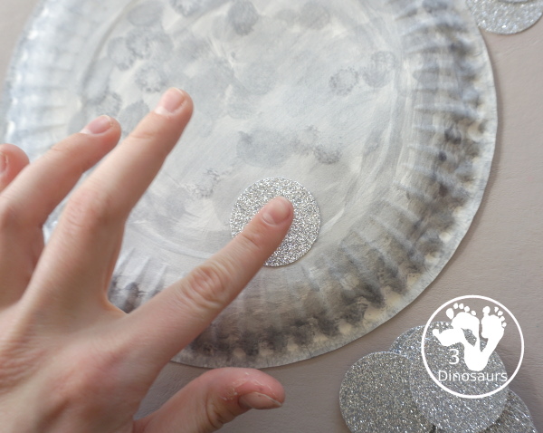 New Years Glitter Ball Craft - made with a paper plate, dot marker, glue nad glitter cardstock. A great New Years Eve craft for kids.- 3Dinosaurs.com