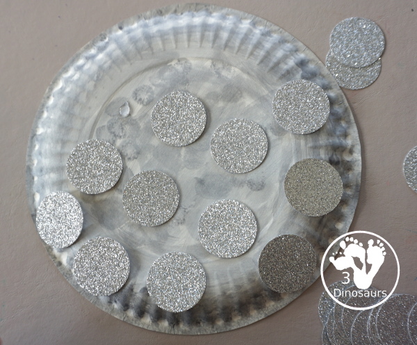 New Years Glitter Ball Craft - made with a paper plate, dot marker, glue nad glitter cardstock. A great New Years Eve craft for kids.- 3Dinosaurs.com