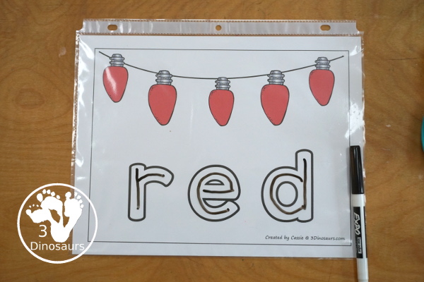  Free Christmas Color Word Playdough Mat Printables - a strip of Christmas lights in a single color with color word below. A fun Christmas theme for color word playdough mat for kids.- 3Dinosaurs.com