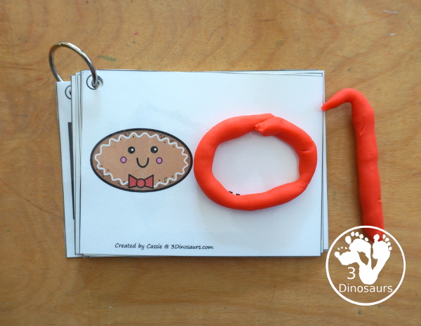 Free Gingerbread Shape Tracing Card Printable - has 12 shapes for kids to trace. You have a picture of the gingerbread man face with the shape, and then a shape to trace.  3Dinosaurs.com