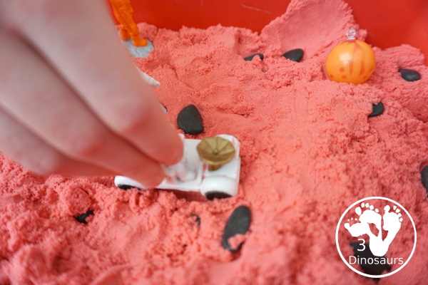 Mars Themed Sensory Bin with kinetic sand - a fun way to explore the red planet Mars -  3Dinosaurs.com
