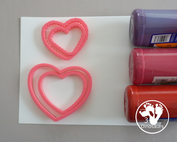 Heart Cookie Cutter Painting - a super easy craft for kids to do with cookie cutters and paint that you can do with tot, preschool and kindergarten - 3Dinosaurs.com