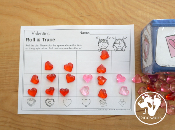 Valentine Roll & Graph With Trace Letters, Numbers & Shapes with a folding die and cube die with a graphing sheet, graphing with tracing numbers, graphing with tracing letters and graphing with tracing shapes. All with a fun heart theme for Valentine for prek and kindergarten - 3Dinosaurs.com