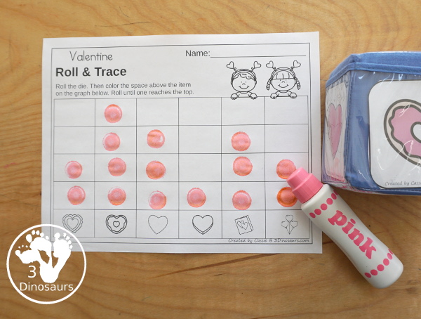 Valentine Roll & Graph With Trace Letters, Numbers & Shapes with a folding die and cube die with a graphing sheet, graphing with tracing numbers, graphing with tracing letters and graphing with tracing shapes. All with a fun heart theme for Valentine for prek and kindergarten - 3Dinosaurs.com