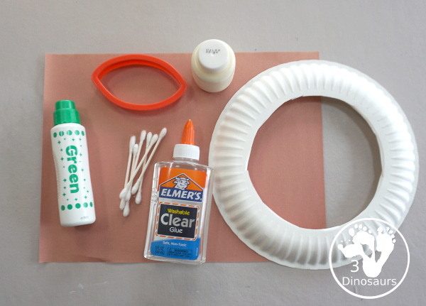 Football Wreath Craft For Kids - a fun wreath craft for a football theme. You have a green wreath with white lines and footballs around the wreath. Great for any football theme. - 3Dinosaurs.com