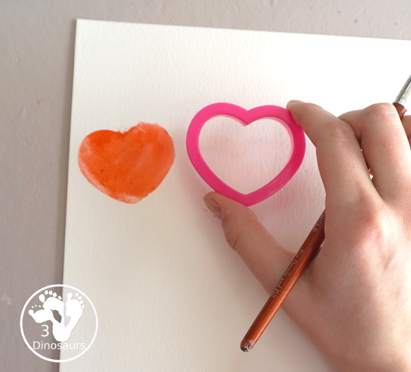 Rainbow Heart Watercolor Painting - a fun heart shape cookie cutter painting you can do with kids. - 3Dinosaurs.com