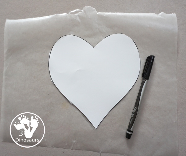 Stained Glass Hearts Craft For Valentine's Day - a simple wax paper craft for kids with tissue paper glue and tissue paper. - 3Dinosaurs.com