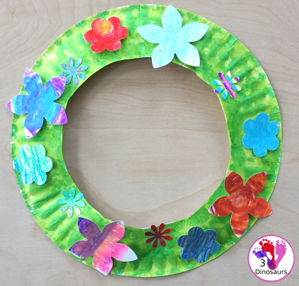 Flower Themed Paper Plate Wreath: Oil Pastels - fun and easy wreaths to make at any time using flower punches and paper plates - 3Dinosaurs.com