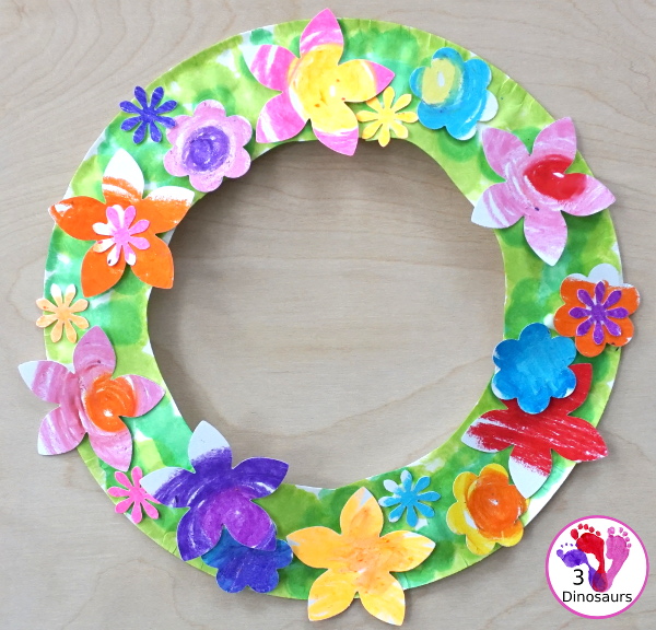 Flower Themed Paper Plate Wreath: Oil Pastels - fun and easy wreaths to make at any time using flower punches and paper plates - 3Dinosaurs.com
