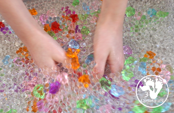 Rainbow Colors Water Bead Sensory Bin - a great sensory bin exploring colors through clear water beads a fun sensory play for kids to do. - 3Dinosaurs.com