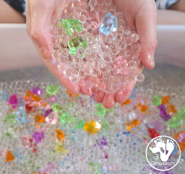 Rainbow Colors Water Bead Sensory Bin - a great sensory bin exploring colors through clear waterbeads a fun sensory play for kids to do. - 3Dinosaurs.com