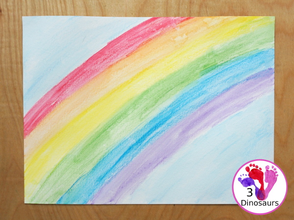 Rainbow Watercolor Pencil Painting - this is a great way to change up coloring and painting activities and watch how the pencil coloring mixes on the paper and makes a great watercolor painting  - 3Dinosaurs.com