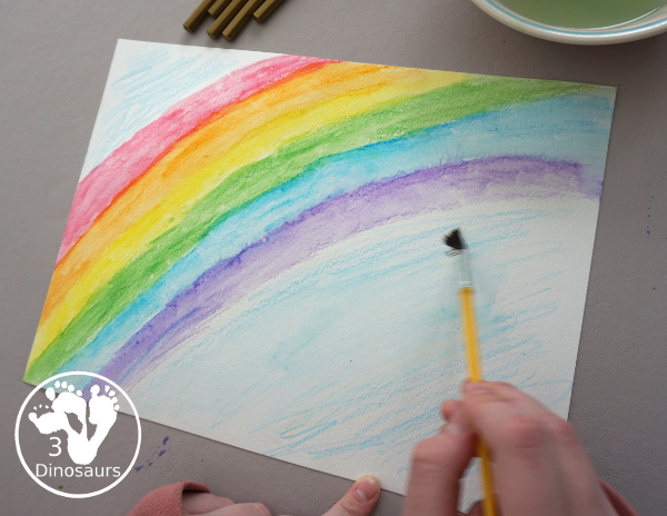 Rainbow Watercolor Pencil Painting - this is a great way to change up coloring and painting activities and watch how the pencil coloring mixes on the paper and makes a great watercolor painting  - 3Dinosaurs.com