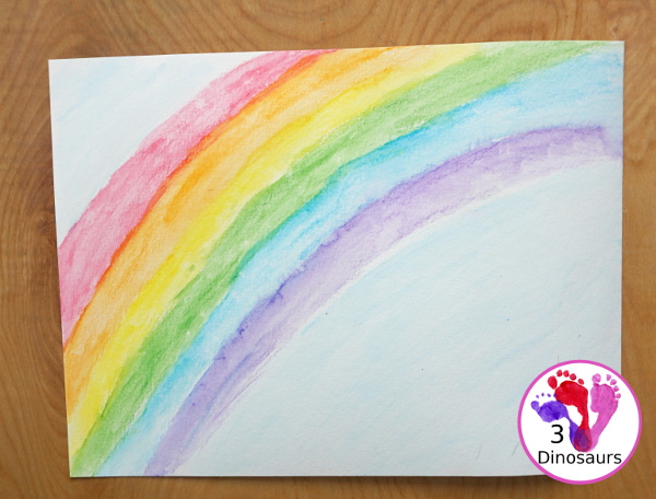 Rainbow Watercolor Pencil Painting - this is a great way to change up coloring and painting activities and watch how the pencil coloring mixes on the paper and makes a great watercolor painting  - 3Dinosaurs.com