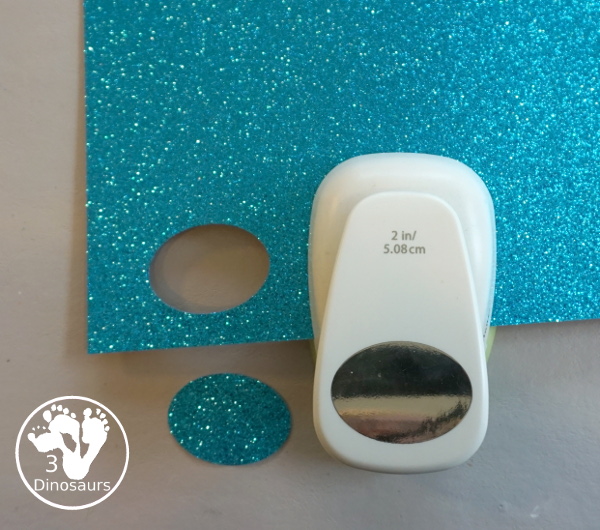 Glitter Easter Egg Wreath Craft - a fun Easter Egg wreath made with a paper plate and ovals for the eggs - 3Dinosaurs.com