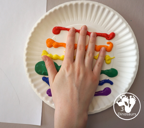 Hand Print Rainbow- you can make a rainbow with paint and a hand and it is fun for kids to make the rainbow. This is great for spring and St Patrick's day