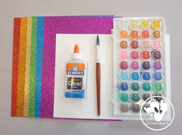 Torn Paper Glitter Rainbow with watercolor Sky Craft - a simple rainbow you can make with torn glitter paper and painting a watercolor background. A simple rainbow for kids prek to first grade - 3Dinosaurs.com