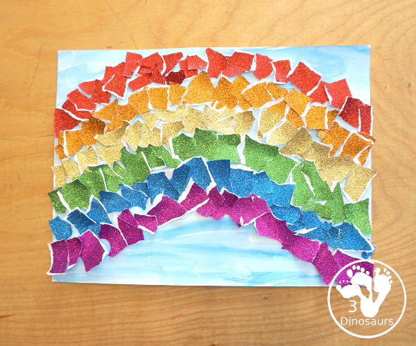 Torn Paper Glitter Rainbow with watercolor Sky Craft - a simple rainbow you can make with torn glitter paper and painting a watercolor background. A simple rainbow for kids prek to first grade - 3Dinosaurs.com