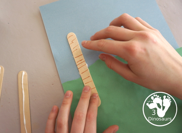 Washi Tape Truffula Tree Craft - a fun Lorax craft for kids to make with a little fun with fine motor truffula craft that kids can make. It is made with paper, washi tape and craft sticks. - 3Dinosaurs.com