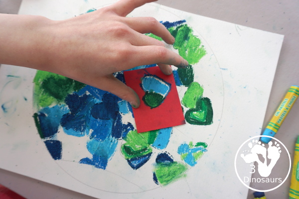 Oil Pastel Earth with Heart Shapes - a great craft that works on blending colors and making a very fun planet Earth for Earth Day - 3Dinosaurs.com