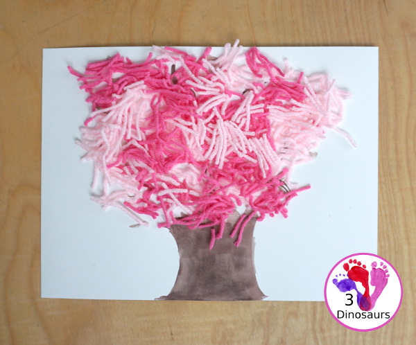 Spring Yarn Tree Craft For Kids - a fun craft made with watercolor for the tree trunk and yarn for the spring blossoms. Super easy to make and great for different ages. - 3Dinosaurs.com