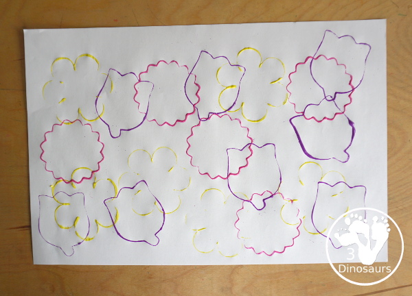 Flower Stamp Painting With Cookie Cutters - cookie cutter in the paint on the paper plate 3Dinosaurs.com
