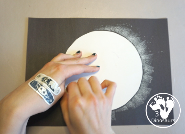 Total Solar Eclipse Pastel Craft - made with a black construction paper and a white chalk pastel - 3Dinosaurs.com
