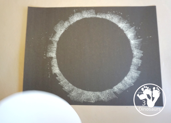 Total Solar Eclipse Pastel Craft - made with a black construction paper and a white chalk pastel - 3Dinosaurs.com
