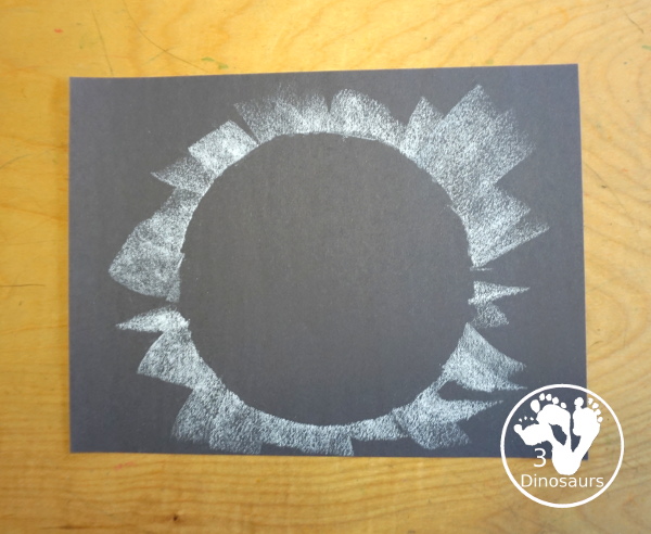 Total Solar Eclipse Pastel Craft - made with a black construction paper and a white chalk pastel - 3Dinosaurs.com