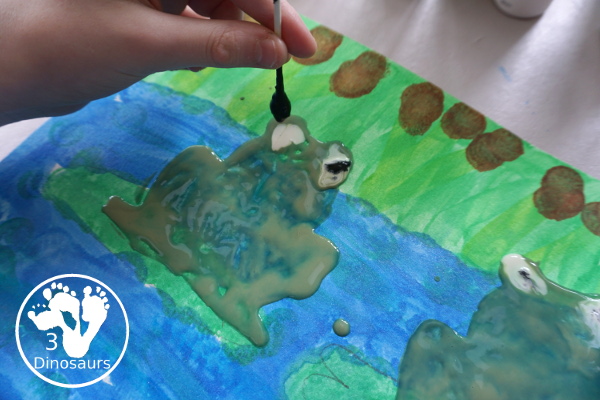 Frog Cookie Cutter Painting - a fun q-tip and dot marker pond painting that is super fun for kids to do - 3Dinosaurs.com