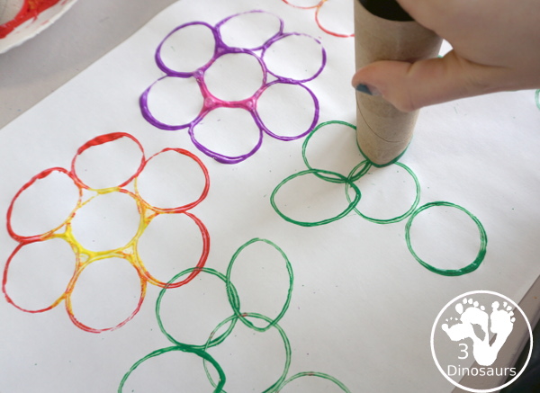 Paper Roll Flower Painting - a simple flower garden craft using paper, paints and paper rolls - making the leaves on the stem of the flower - 3Dinosaurs.com