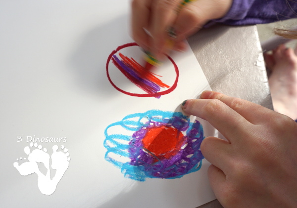 A Fun Space Theme Wreath - make a paper plate wreath with a space theme that has planets and stars - 3Dinosaurs.com 