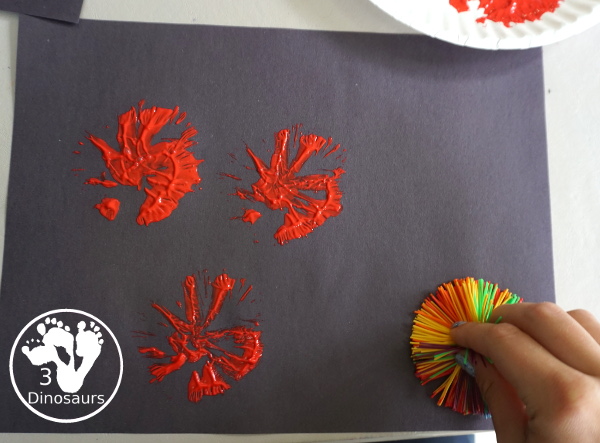 Firework Painting with String Balls - with a simple rubber band string ball painting with different colors and great for the Fourth of July and any Firework themes. And also works for the Opening Ceremony for the Olympics