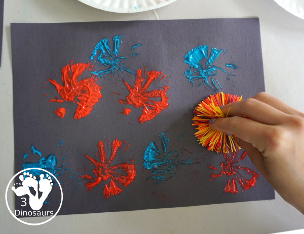 Firework Painting with String Balls - with a simple rubber band string ball painting with different colors and great for the Fourth of July and any Firework themes. And also works for the Opening Ceremony for the Olympics