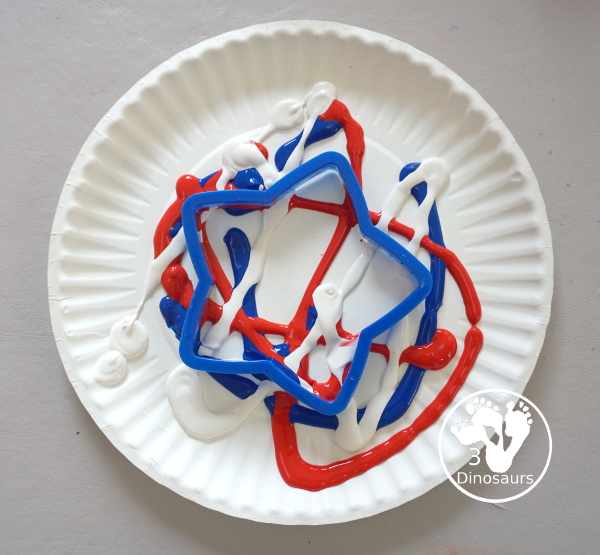Red, White, and Blue Stamping - a simple painting with cookie cutters that you can do with kids using a flag shape and starts for the Fourth of July. - 3Dinosaurs.com