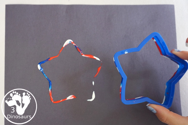 Red, White, and Blue Stamping - a simple painting with cookie cutters that you can do with kids using a flag shape and starts for the Fourth of July. - 3Dinosaurs.com