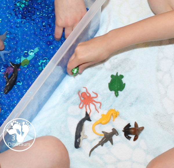 Ocean Water Bead Sensory Bin - a simple water bead sensory bin with ocean figures for kids to play in for word ocean day.- 3Dinosaurs.com