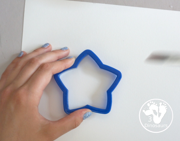Stars & Flag Watercolor Painting with Cookie Cutters - a simple painting activity that you can do with kids with red and blue colors painting inside stars and flags.- 3Dinosaurs.com
