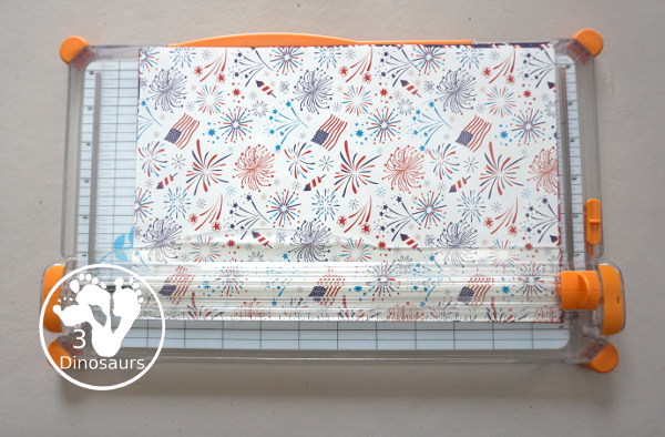 Red White and Blue Wreath Craft - a fun wreath craft made with scrapbook or any type Fourth of July paper with the red and blue themed paper around the paper plate. A simple craft you can do with preschool, prek and kindergarten age kids. - 3Dinosaurs.com