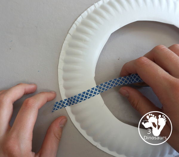 Red, White, and Blue Washi Tape Wreath - a simple paper plate wreath made with washi tape with colors for the Fourth of July. 3Dinosaurs.com