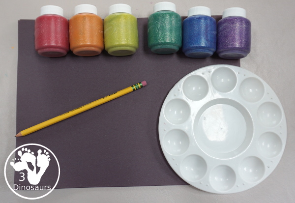 Finger Painting Fireworks with Glitter Paint for kids - easy and fun sensory painting activity that is a great way to make fireworks. - 3Dinosaurs.com