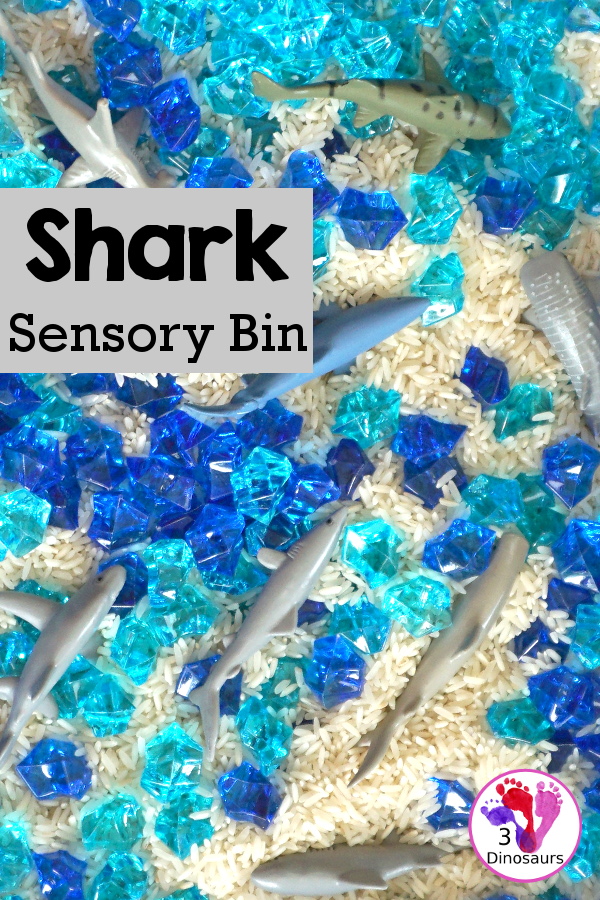 Shark Rice Sensory Bin for shark week with a mix of acrylic rocks, rice and a shark toob for the shark figures for kids to play in prek and kindergarten - 3Dinosaurs.com