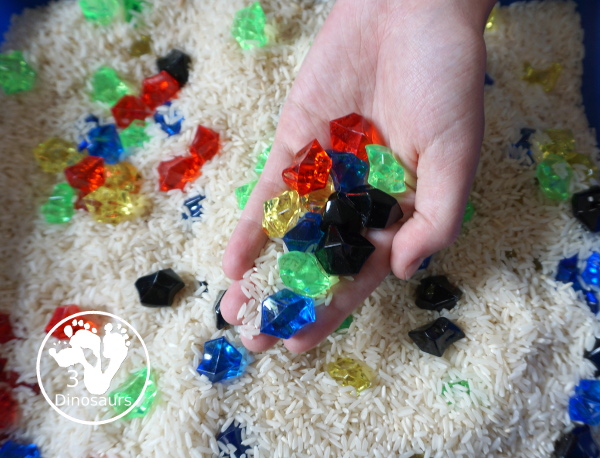 Olympic Flag Colors Sensory Bin - a simple sensory bin to explore the different colors that make the rings on the Olympic Flag - 3Dinosaurs.com