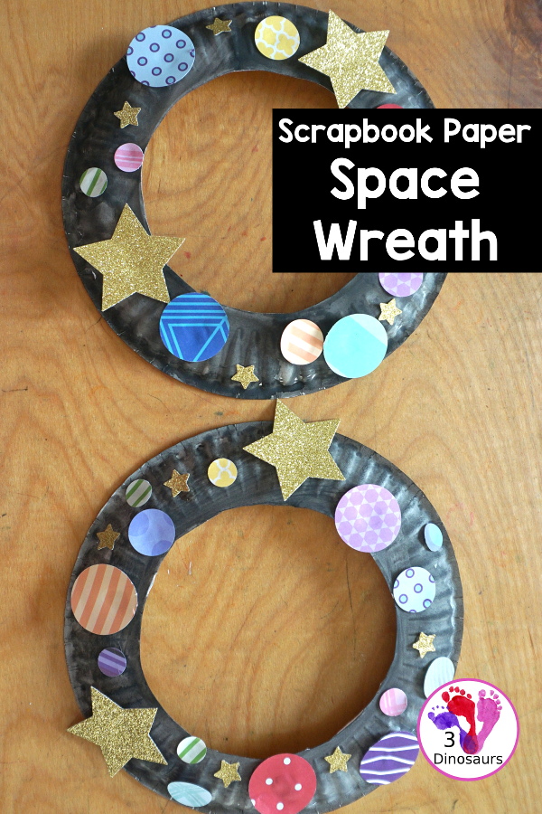 Scrapbook Paper Space Wreath Craft - a fun space craft for kids that is made with a paper plate, craft punches that are circles and stars with glitter paper and scrapbook paper. It makes a fun space craft. - 3Dinosaurs.com