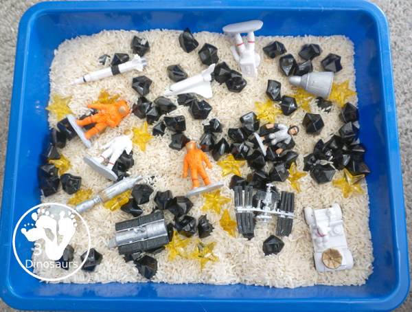 Space Sensory Bin With Rice and Rocks - you have space figures, yellow stars, and rice for this simple sensory b8in. This is great for a space theme with kids. And they will enjoy exploring space themes in the sensory bin. A fun sensory bin for kids in preschool, prek and kindergarten. - 3Dinosaurs.com