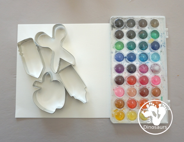 School Cookie Cutter Watercolor Painting - a super easy back to school watercolor painting with cookie cutters with school themes of pencils, scissors, crayons and apples - 3Dinosaurs.com