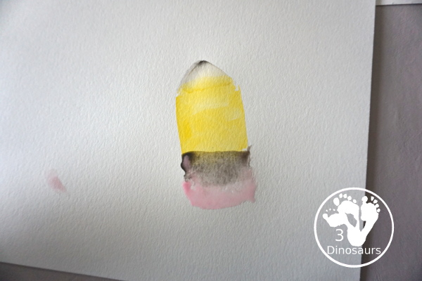 School Cookie Cutter Watercolor Painting - a super easy back to school watercolor painting with cookie cutters with school themes of pencils, scissors, crayons and apples - 3Dinosaurs.com